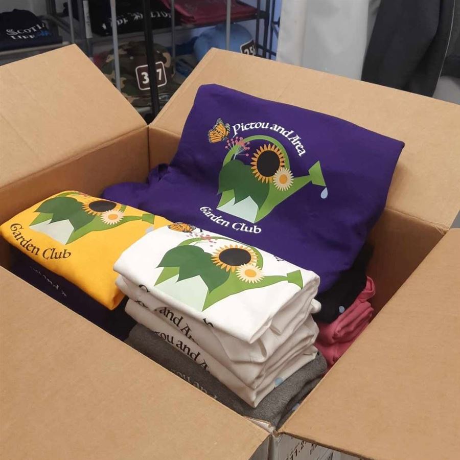 Pictou and Area Garden Club t-shirts in purple, gold, and white