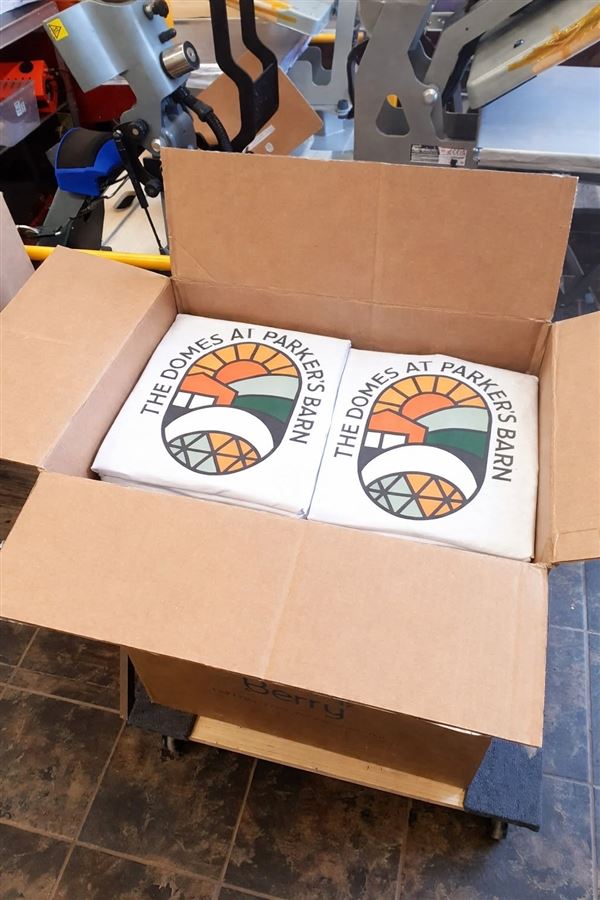 The Domes at Parker's Barn t-shirts packed at the heat press